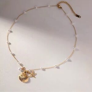 18k gold plated shell necklace.